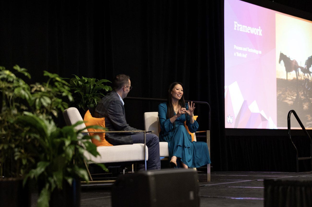 Jennie in conversation on stage at a conference